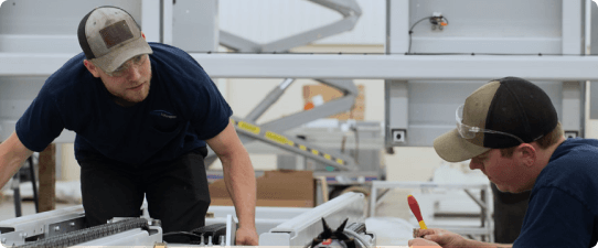 Edge Automation Experts discussing equipment